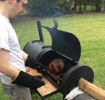 Lucas attempting to BBQ a turkey for Thanksgiving